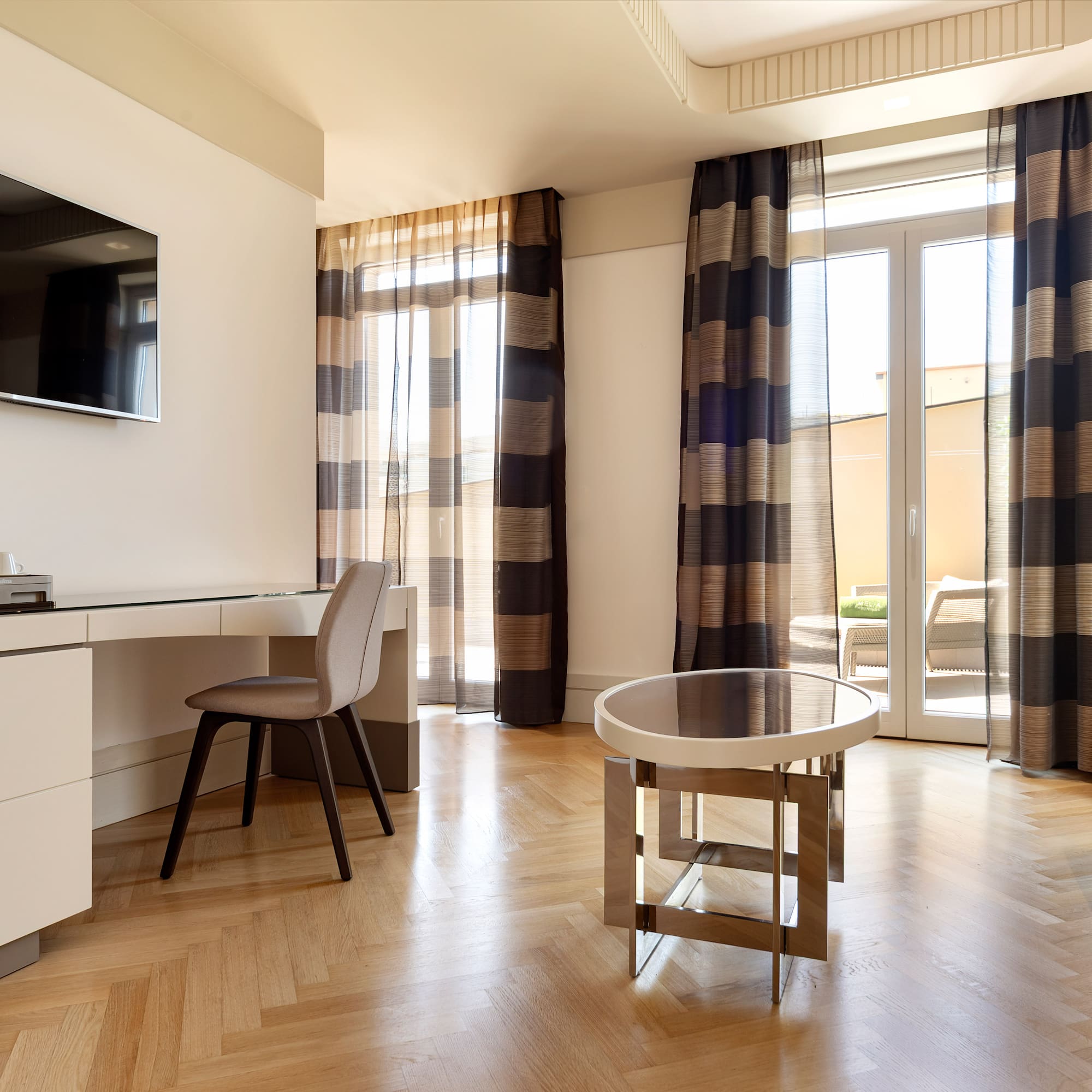 a room with a desk and a television