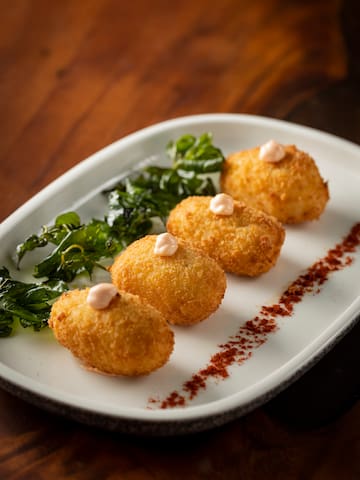 a plate of food on a wood table