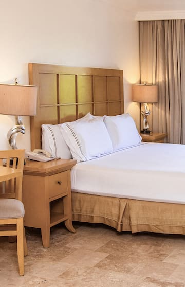 a bed with a telephone and table