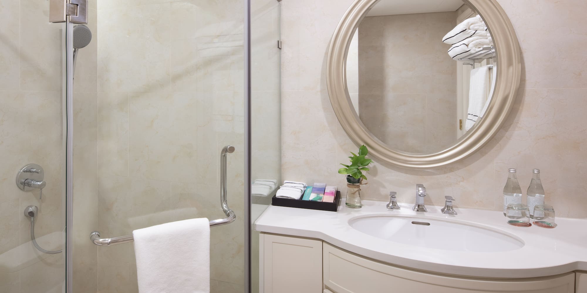 a bathroom with a mirror and a shower