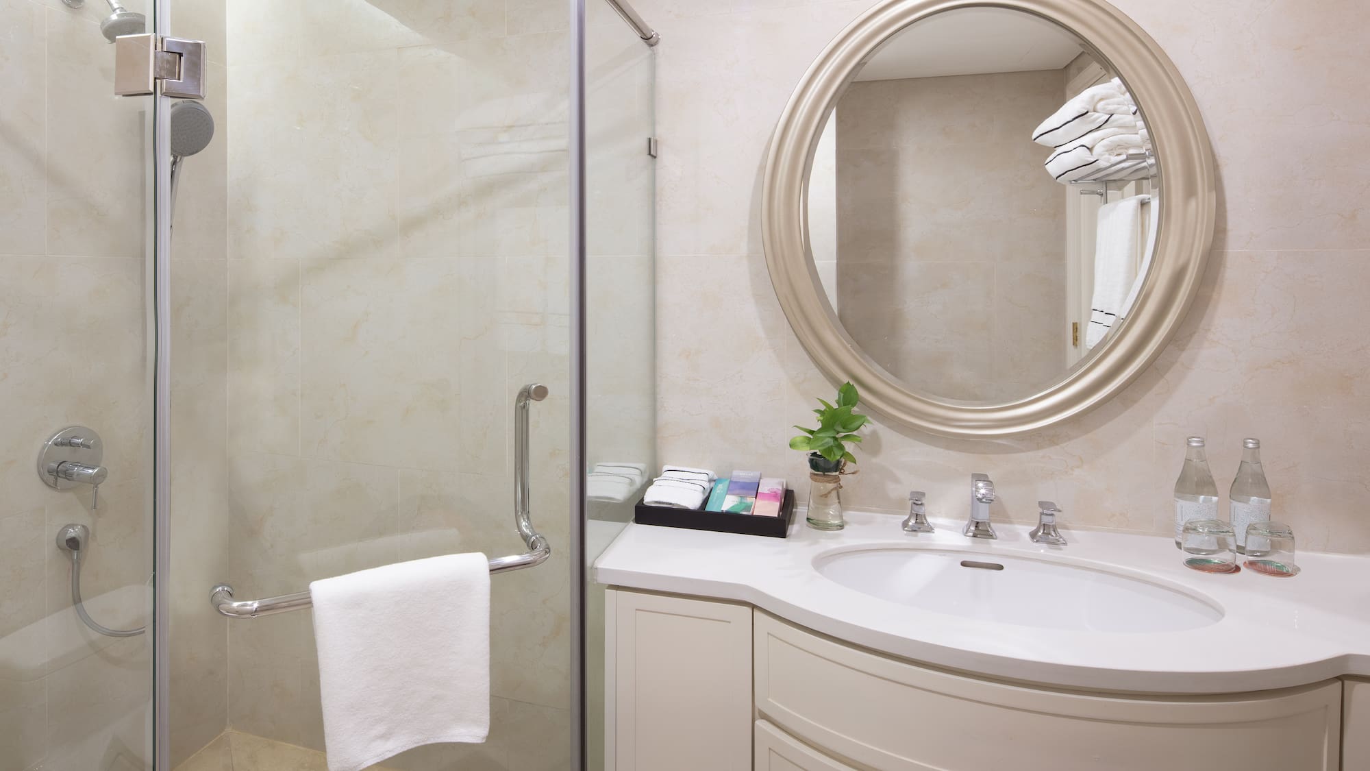 a bathroom with a mirror and a shower