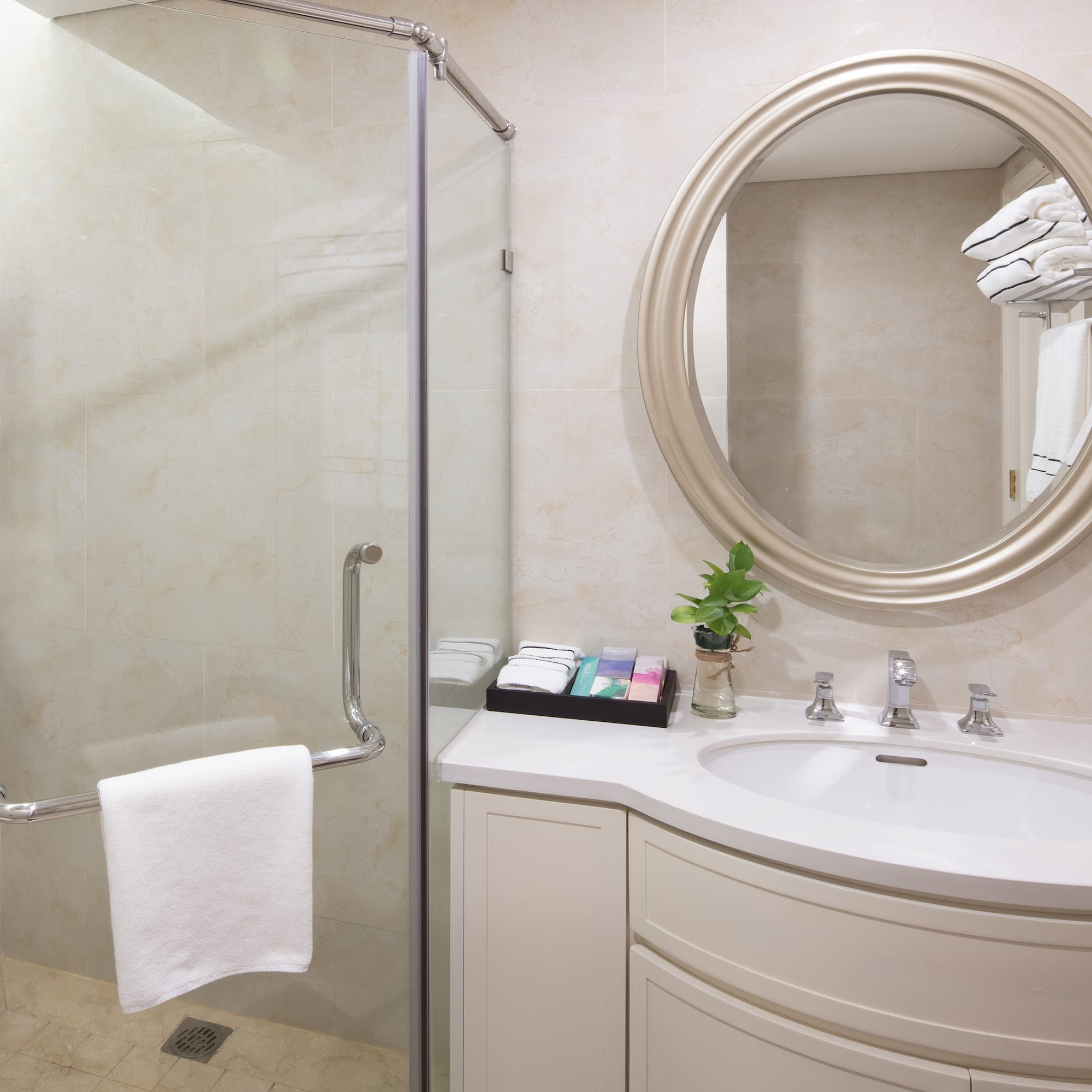 a bathroom with a mirror and a shower