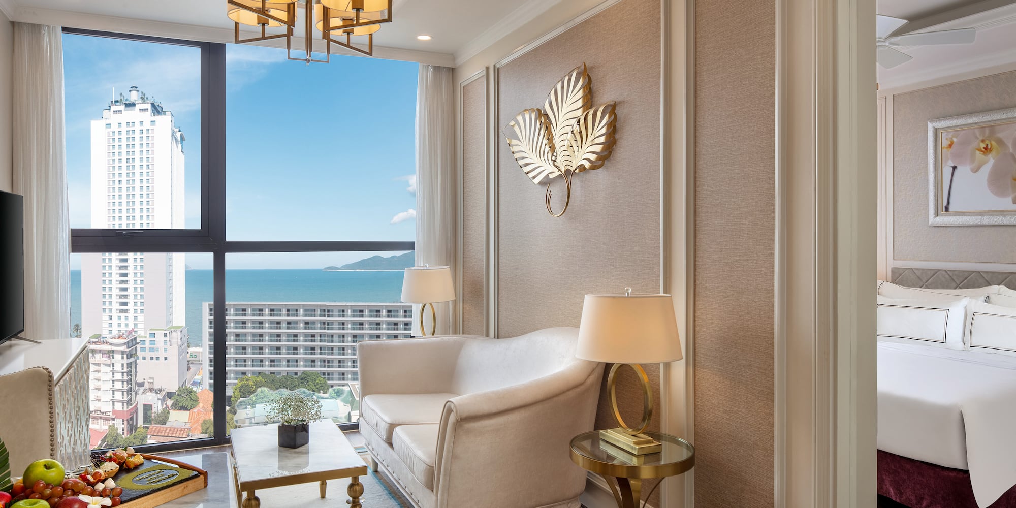 a room with a couch and a table and lamp