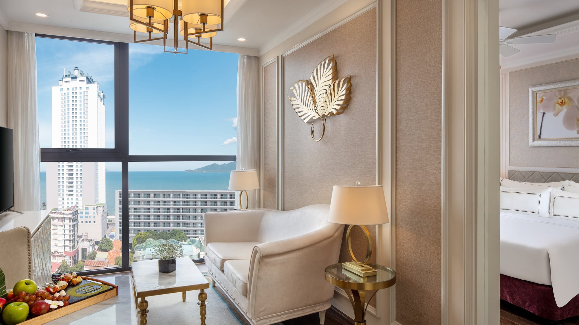 a room with a couch and a table and lamp