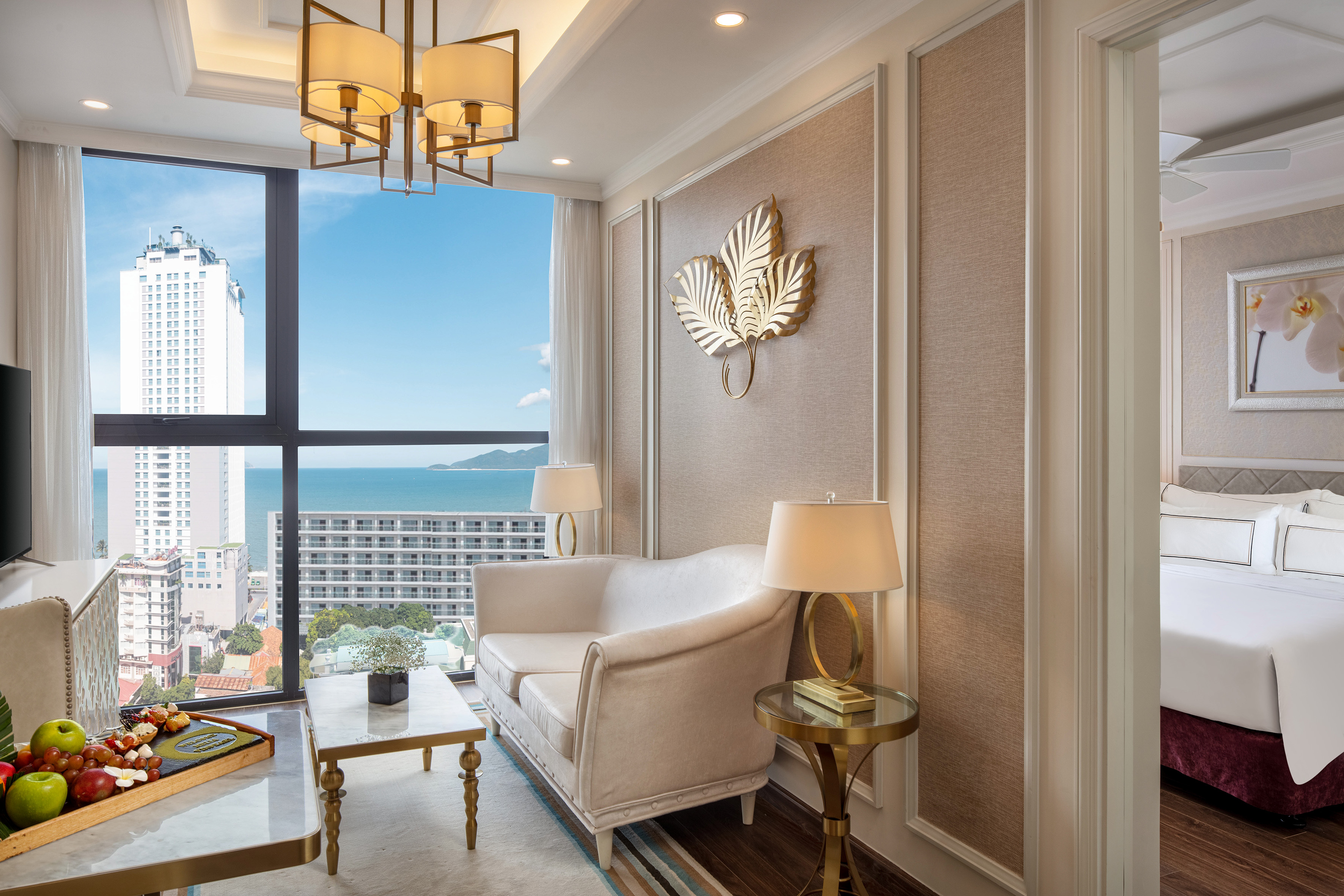 a room with a couch and a table and lamp