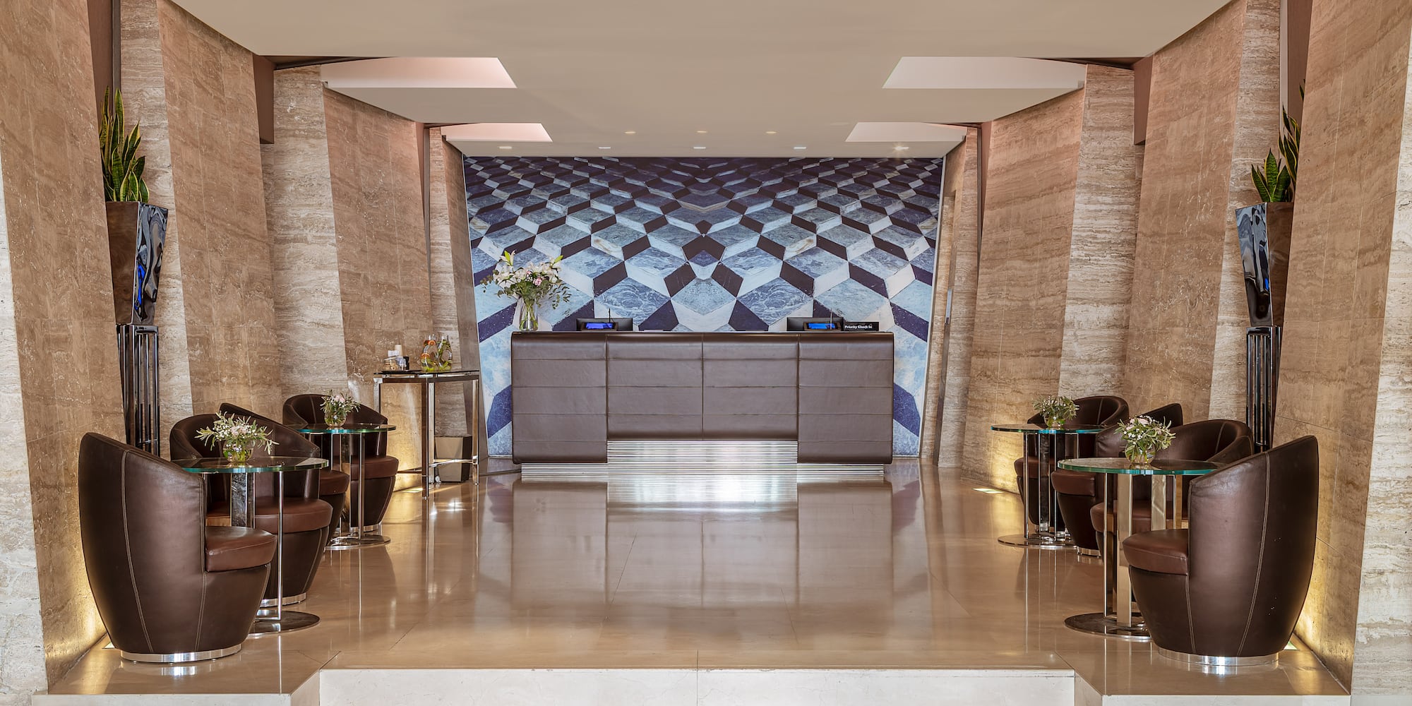 a lobby with a counter and chairs