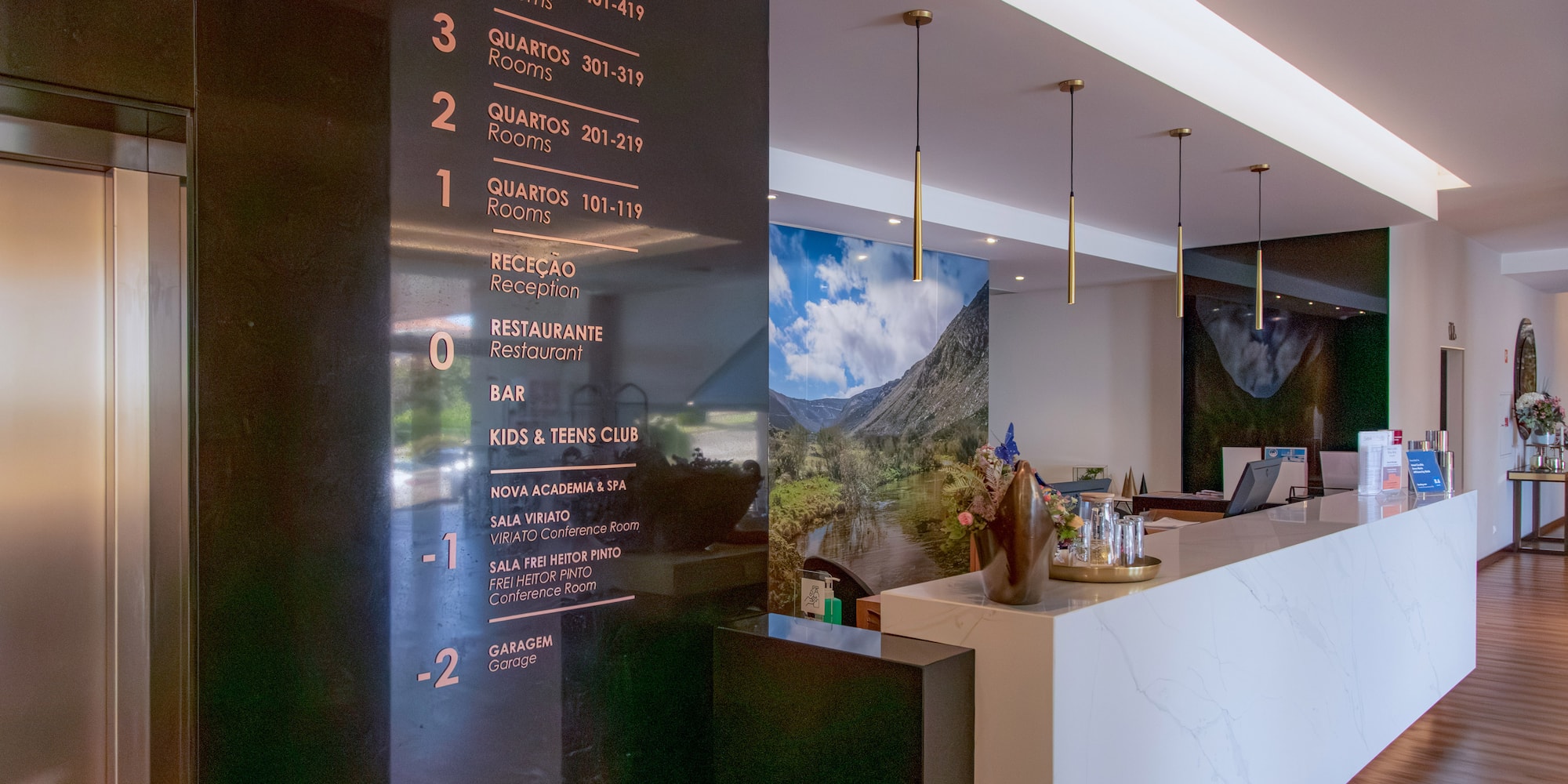 a black sign with gold text on it