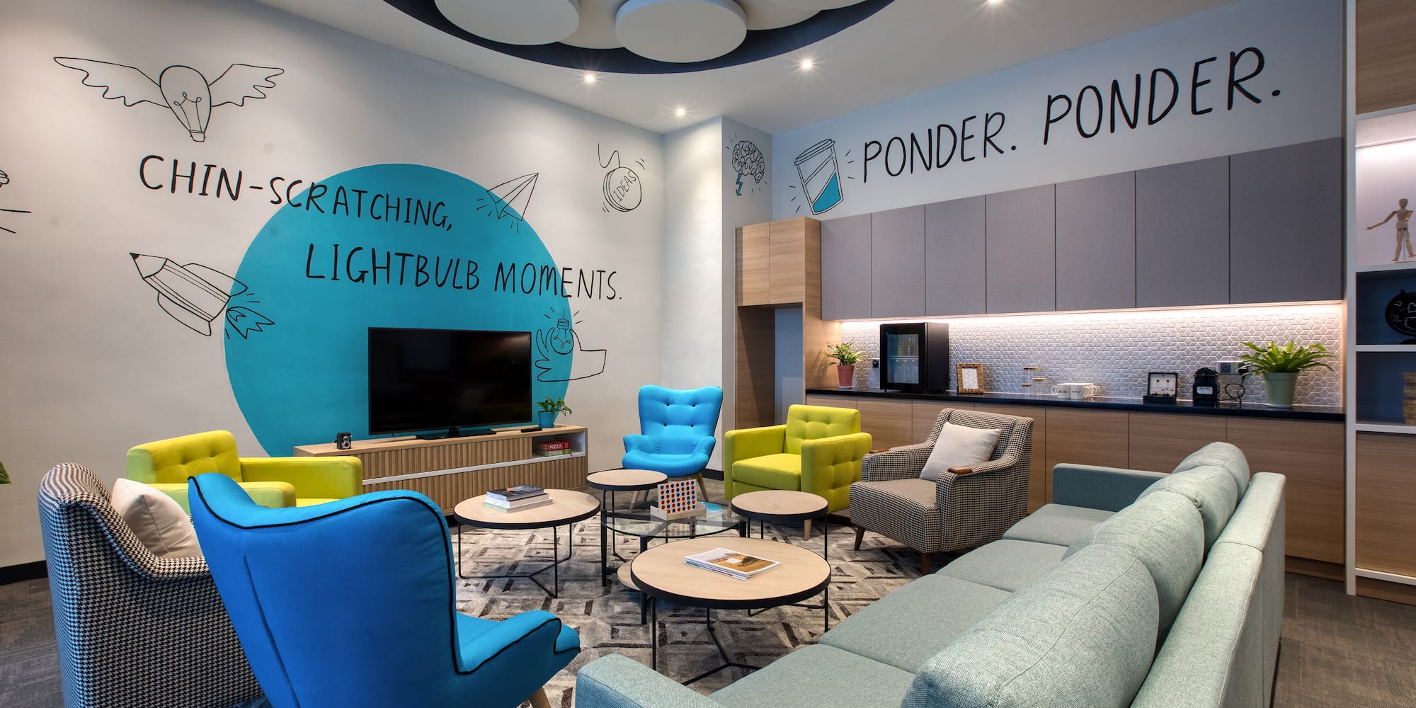 a room with a couch and chairs