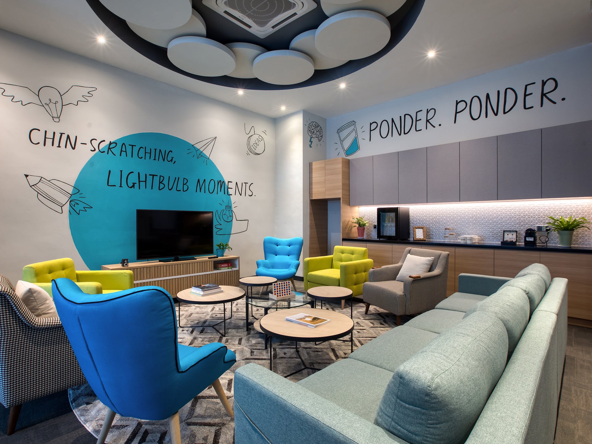 a room with a couch and chairs