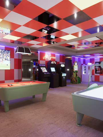 a room with red and white checkered walls and a pool table