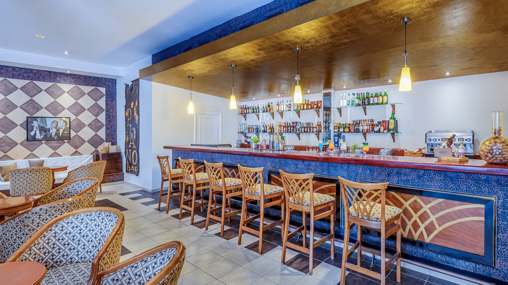 a bar with chairs and a counter