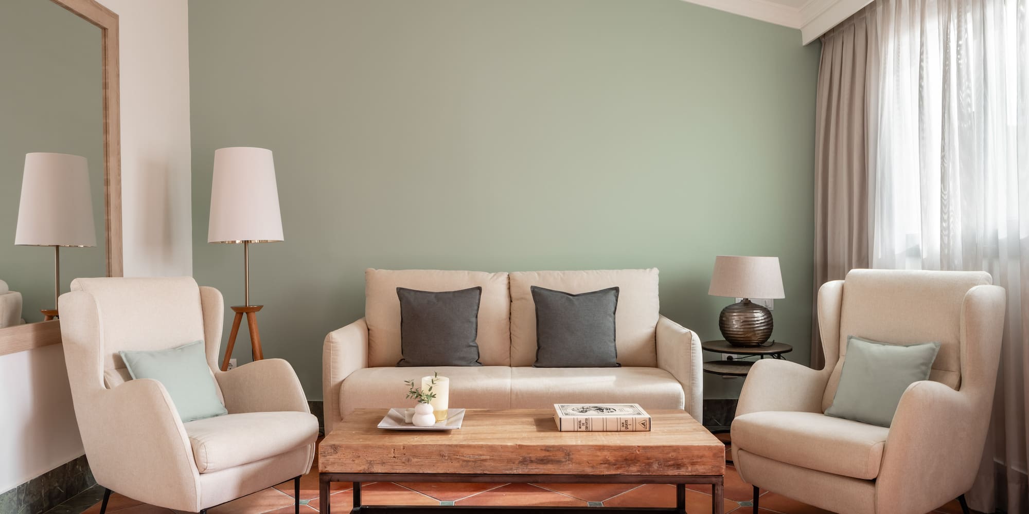 a living room with a couch and chairs