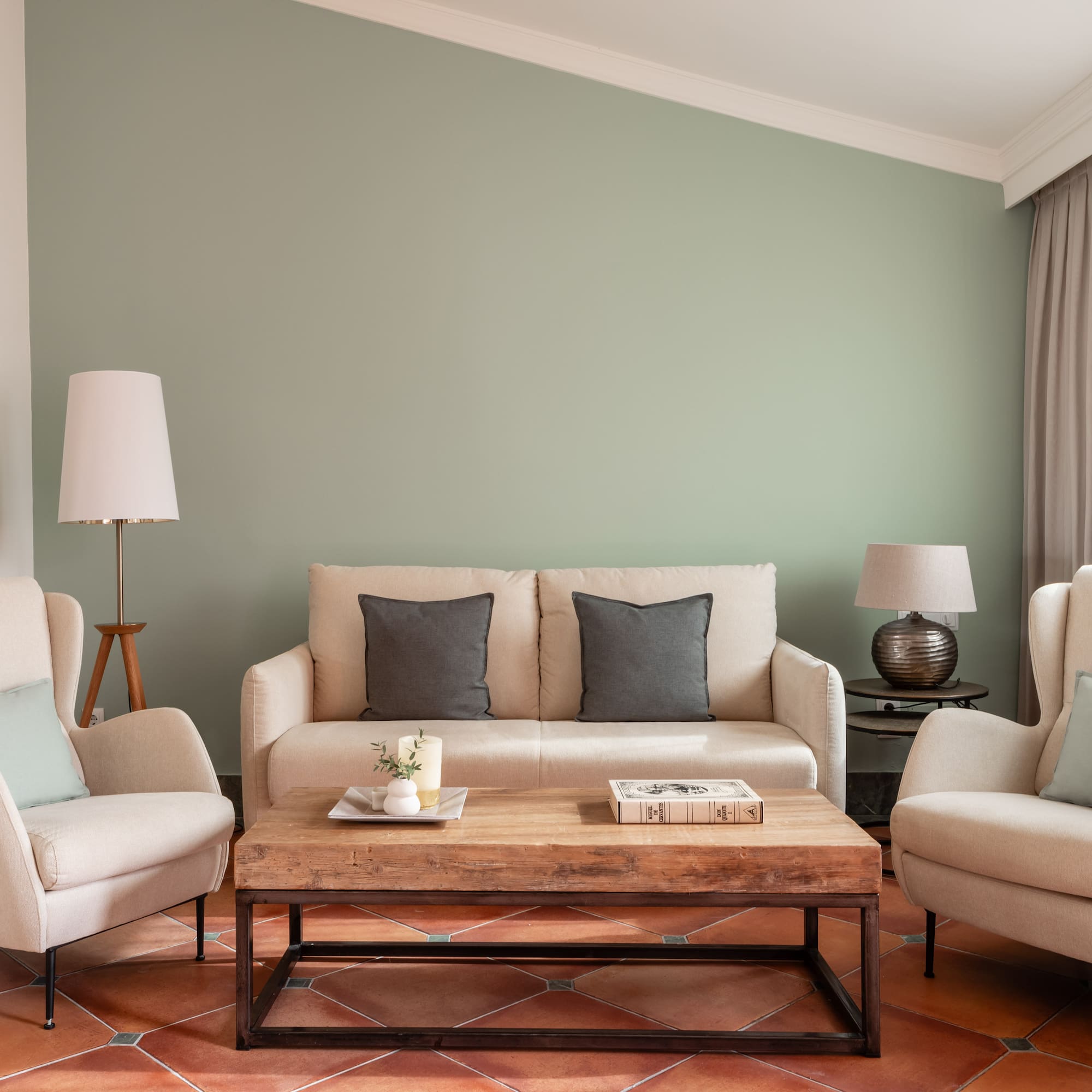 a living room with a couch and chairs