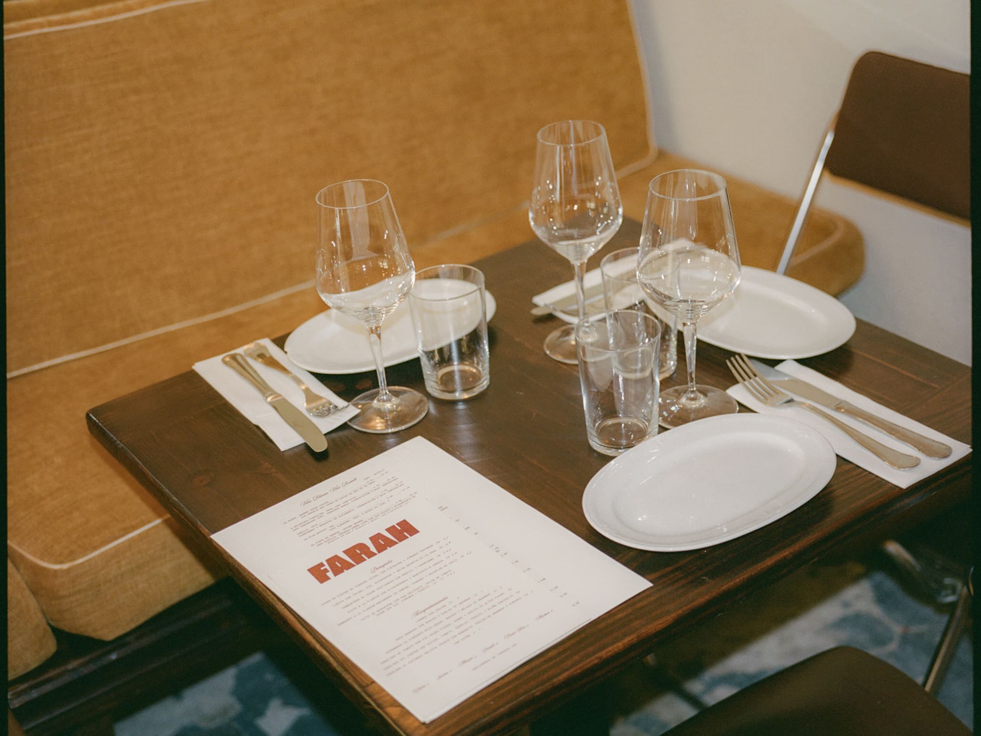 a table with glasses and plates