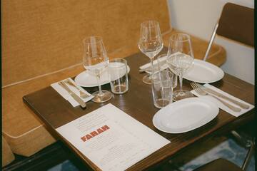 a table with glasses and plates