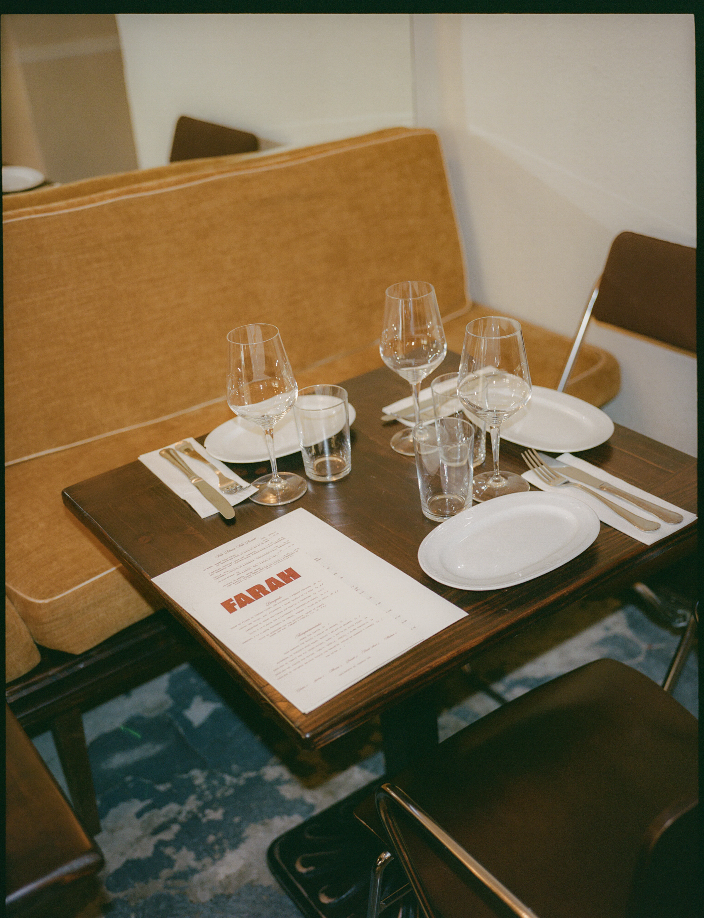 a table with glasses and plates