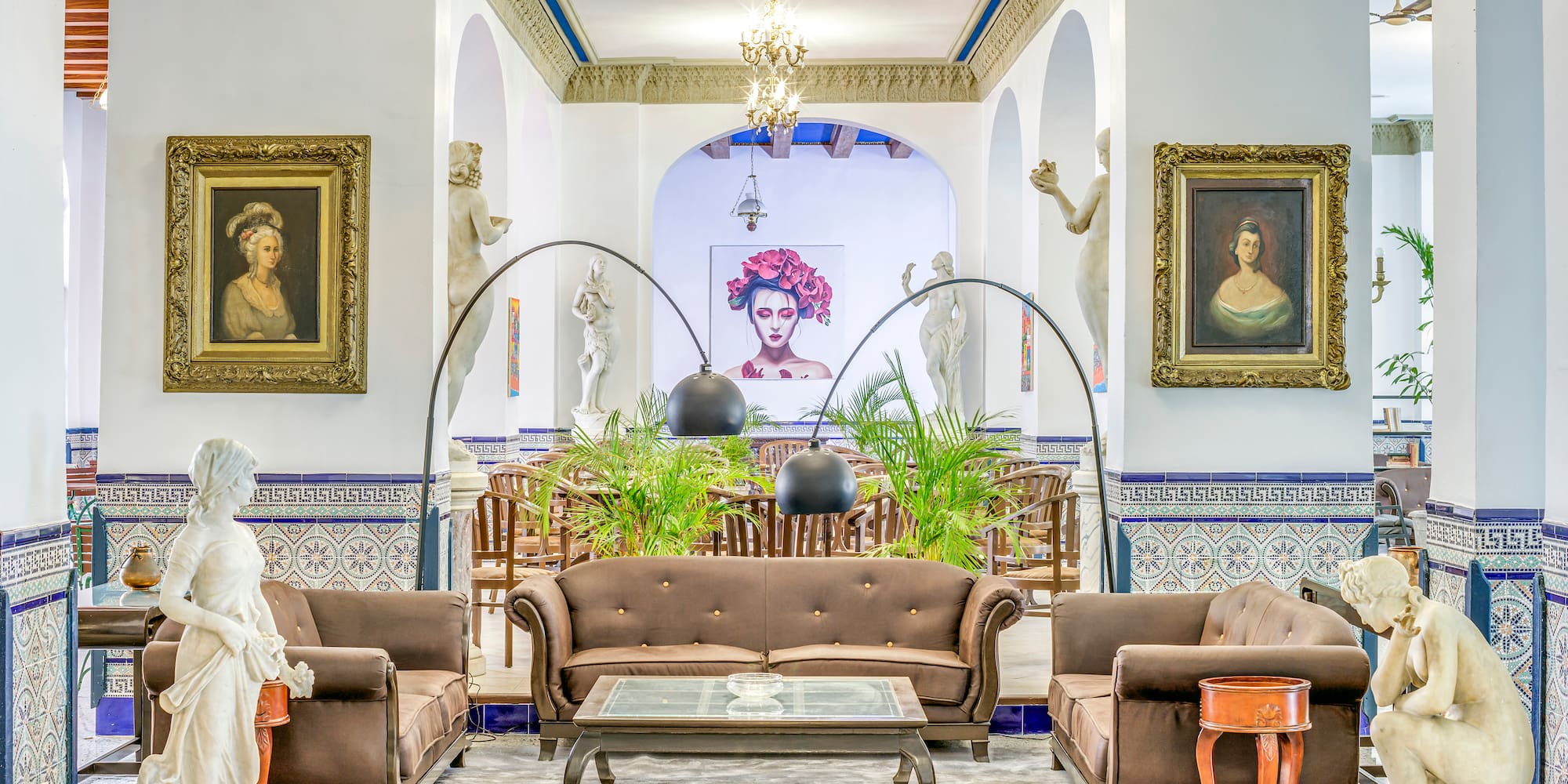 a room with a couch and a table and chairs