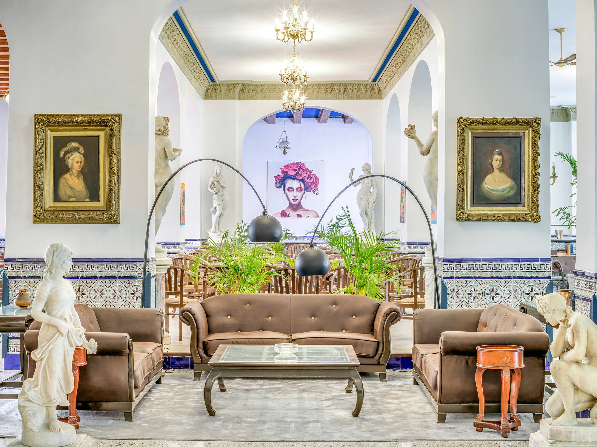 a room with a couch and a table and chairs