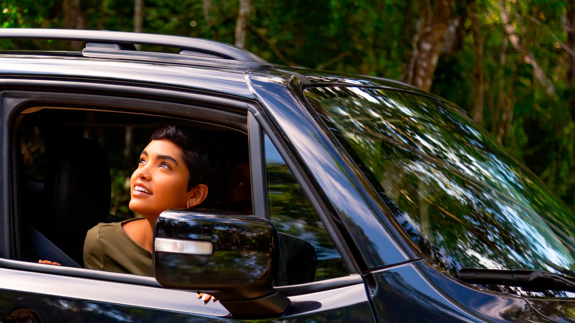 a woman looking out of a car window