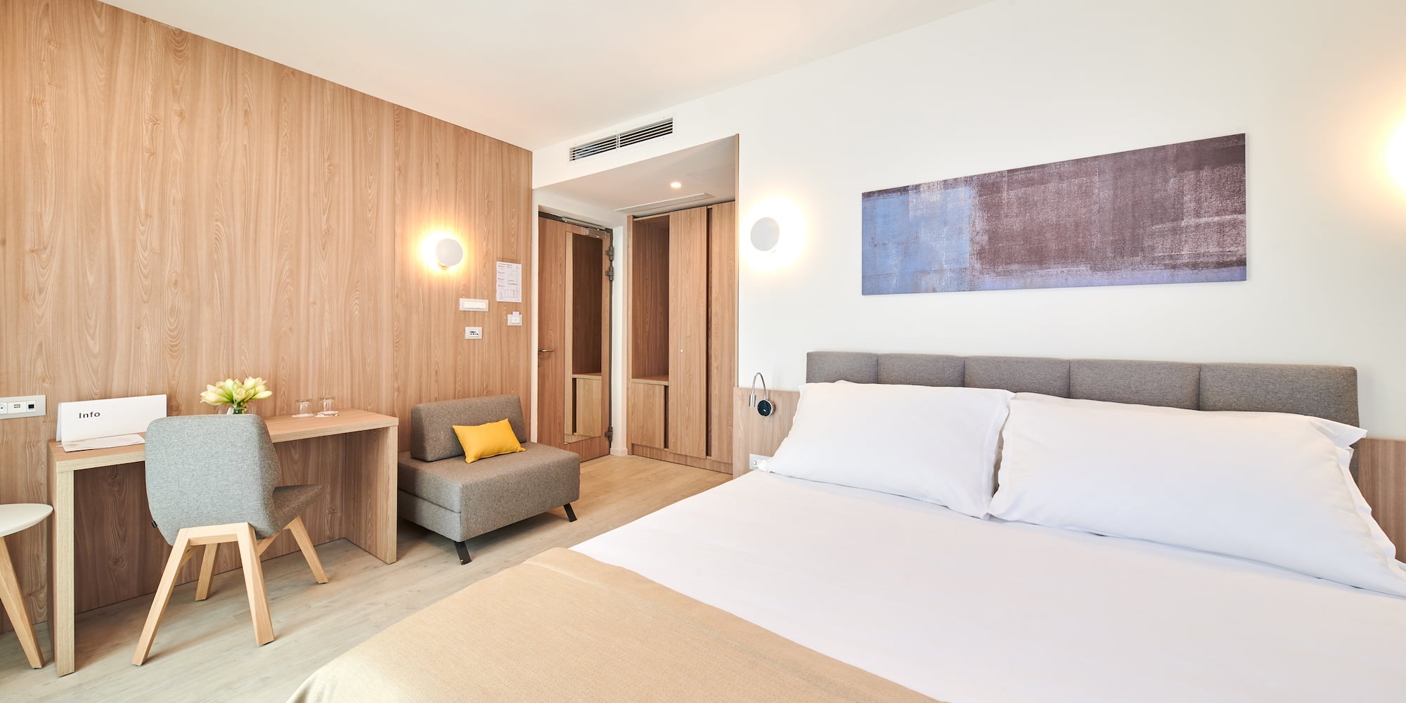 a bedroom with a bed and a chair