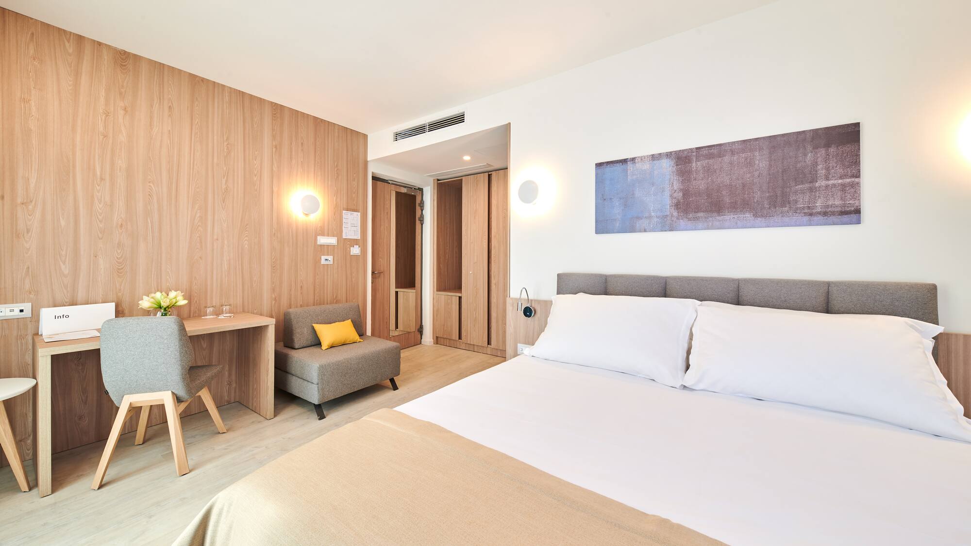 a bedroom with a bed and a chair