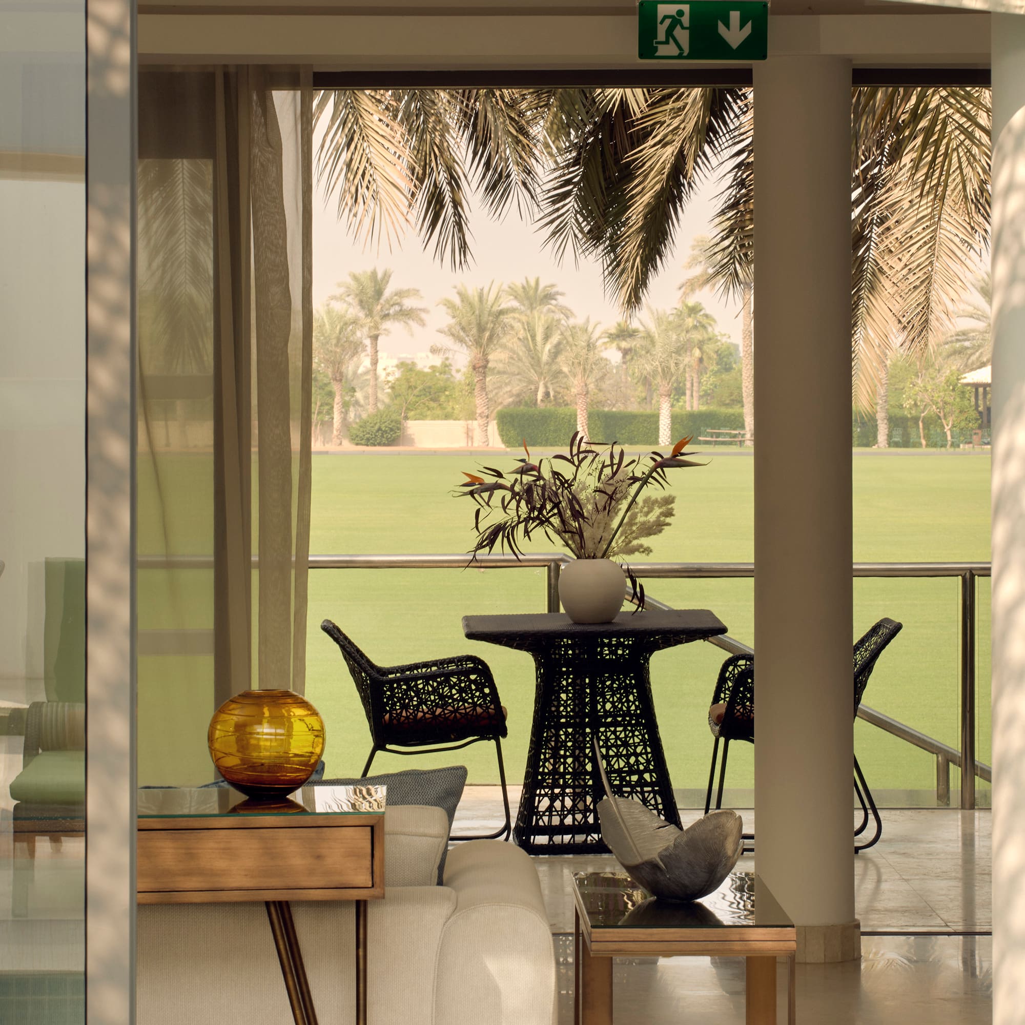 a room with a table and chairs and a lawn