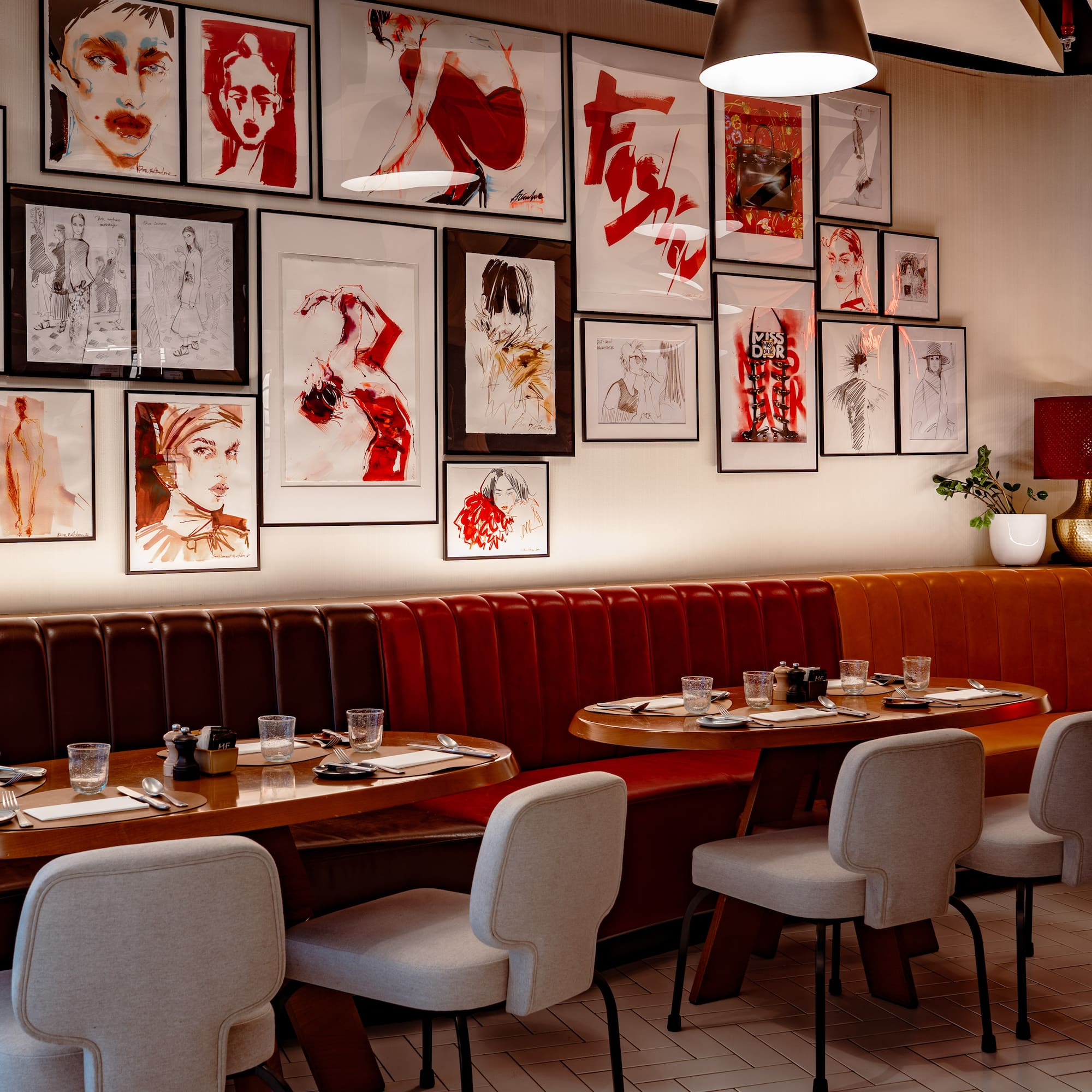 a restaurant with art on the wall