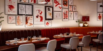 a restaurant with art on the wall