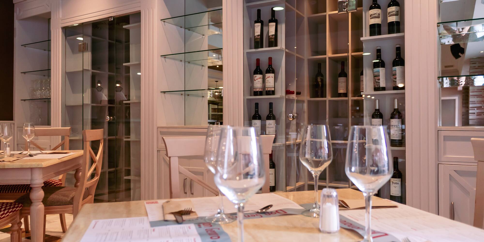 wine glasses on a table in a restaurant