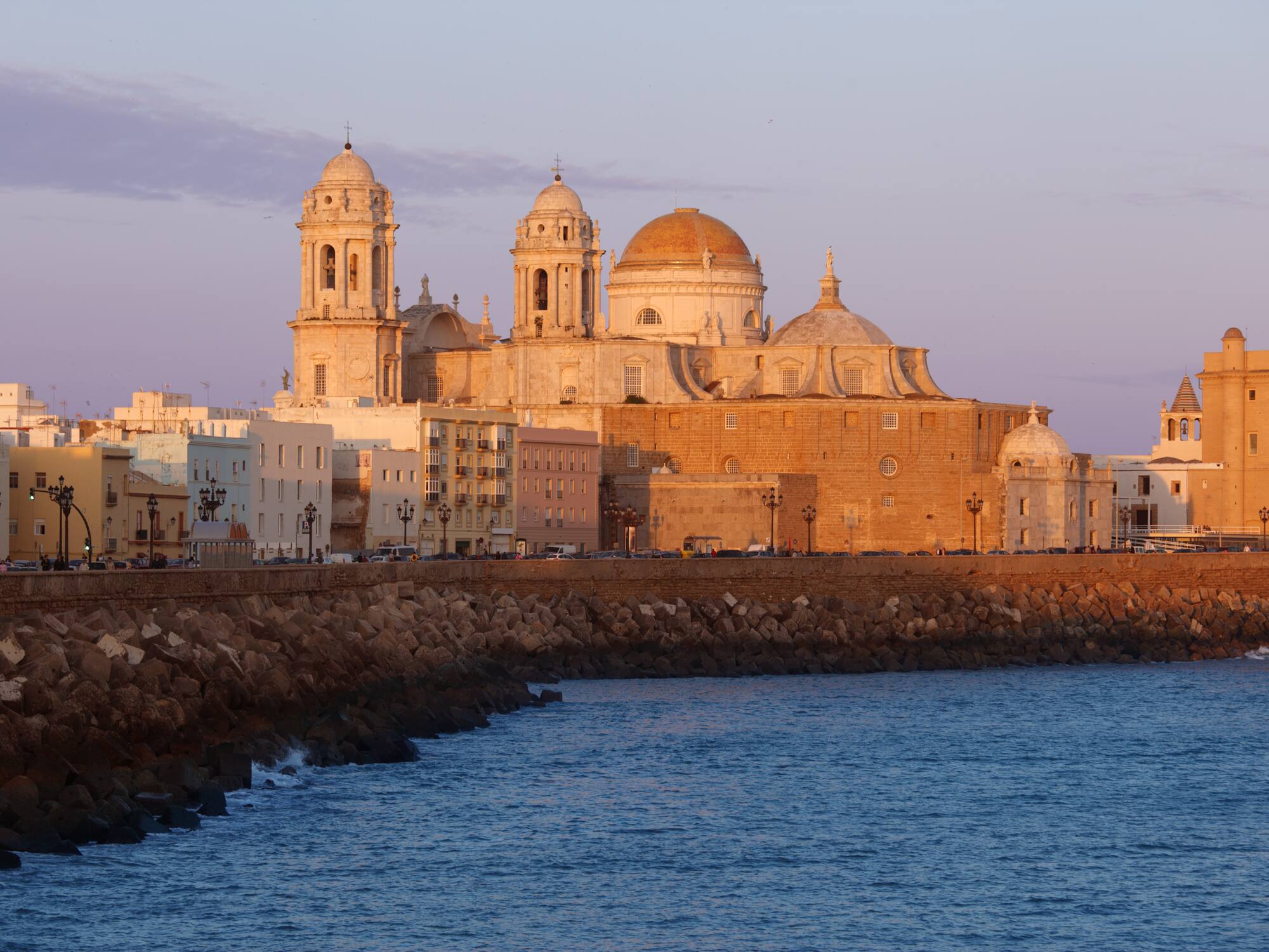 a building with domes and a body of water
