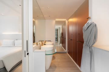 a bathroom with a bathrobe and sink