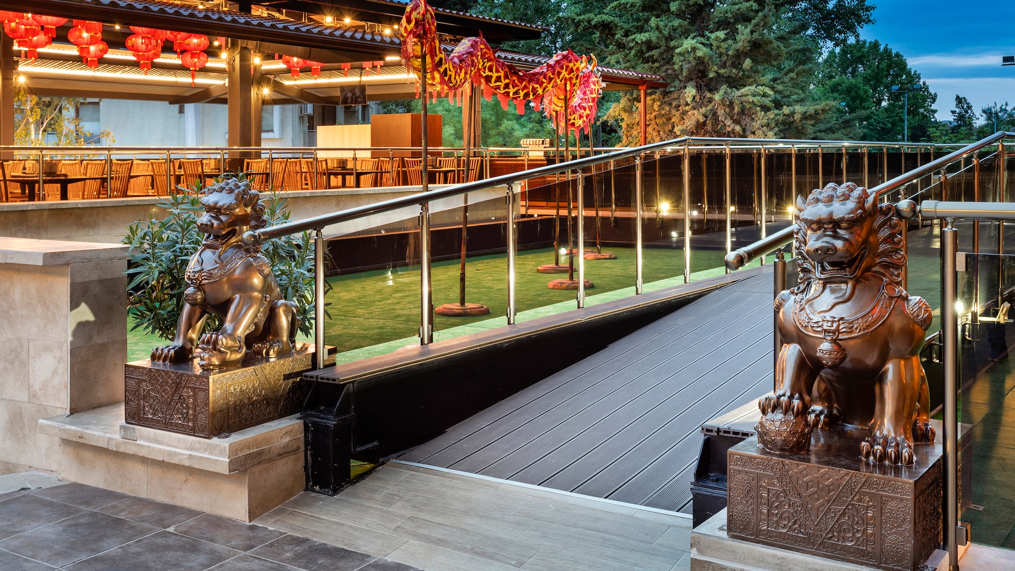 a building with a staircase and statues of lions