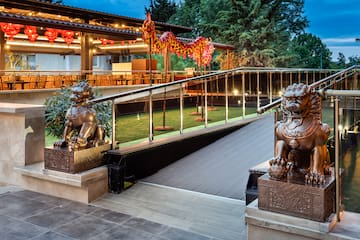 a building with a staircase and statues of lions