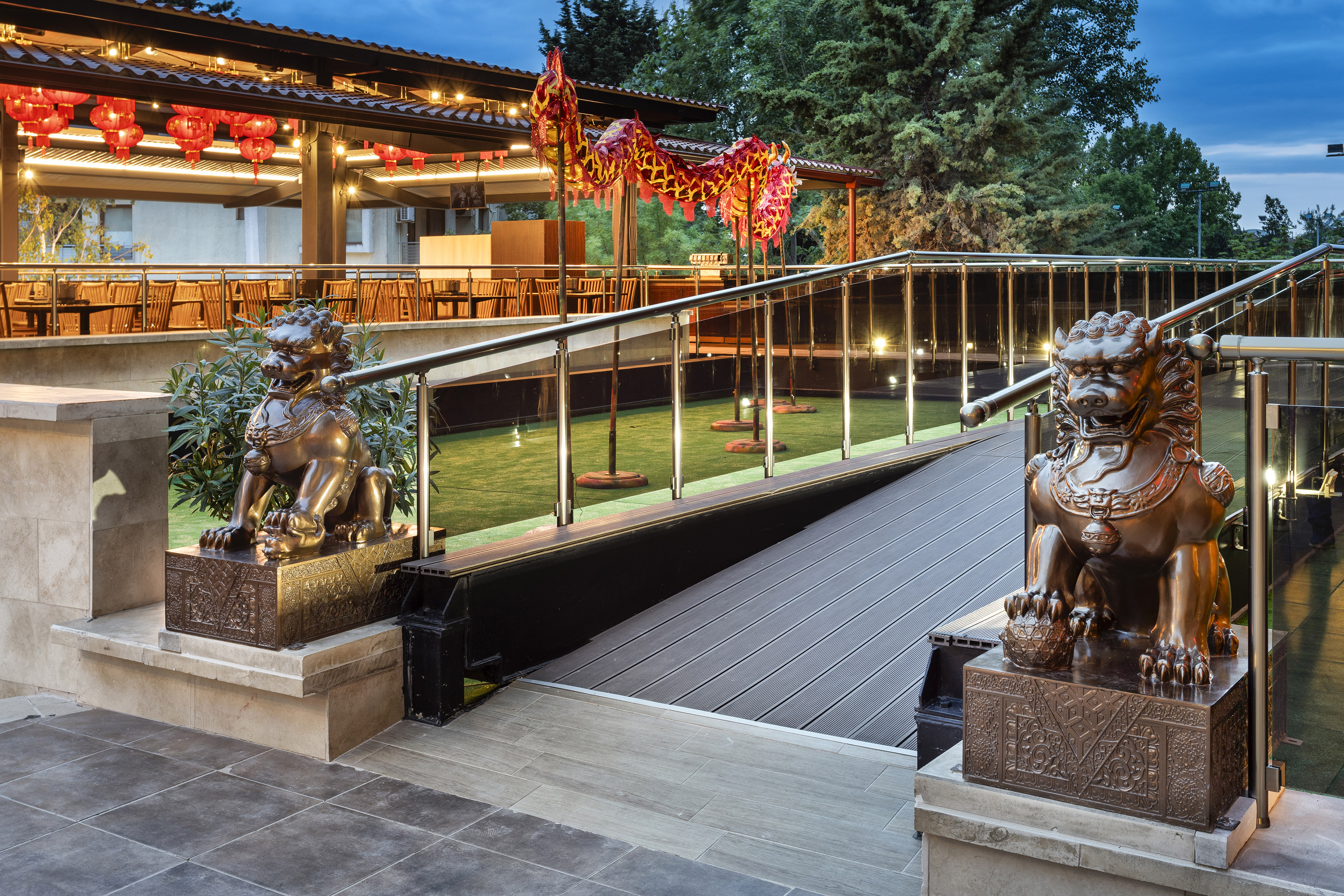 a building with a staircase and statues of lions