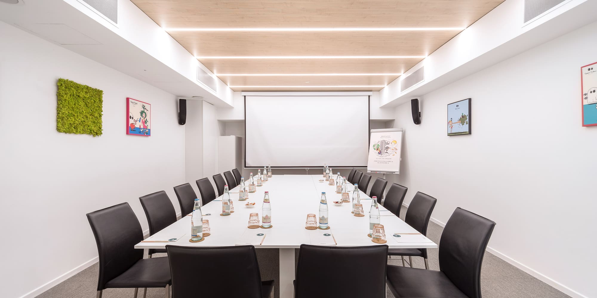 a conference room with a table and chairs