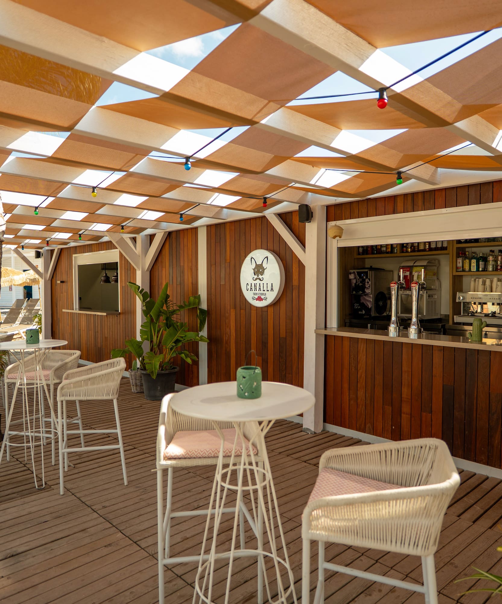 a patio with tables and chairs