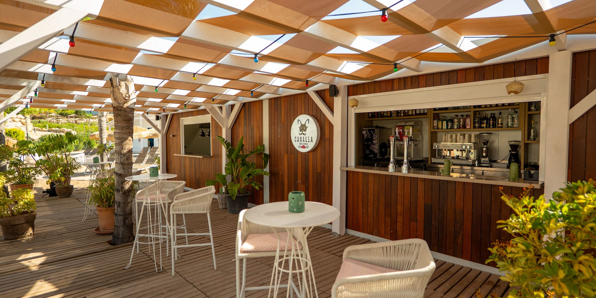 a patio with tables and chairs