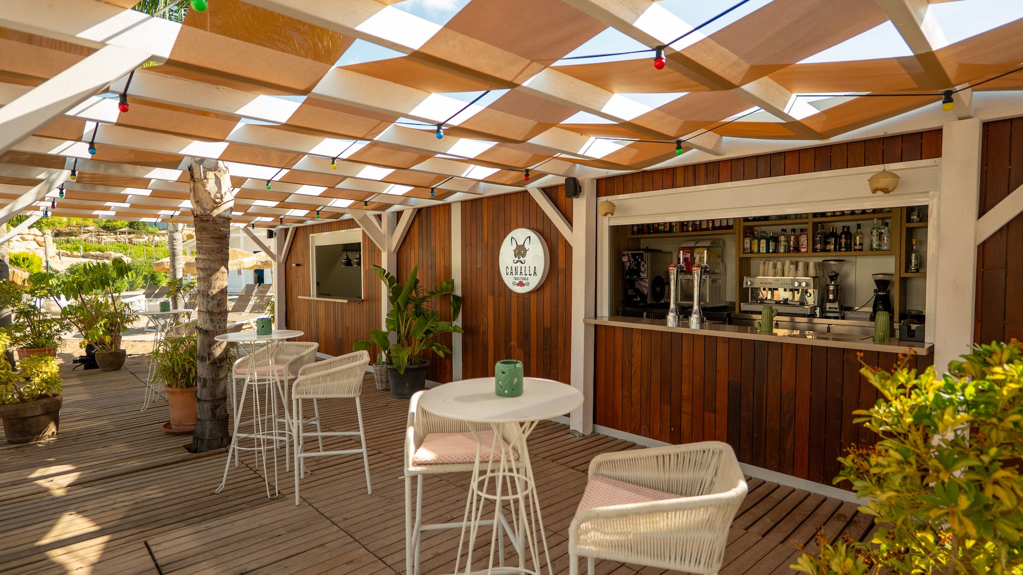 a patio with tables and chairs