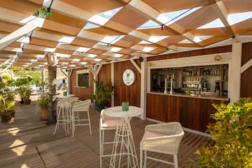 a patio with tables and chairs