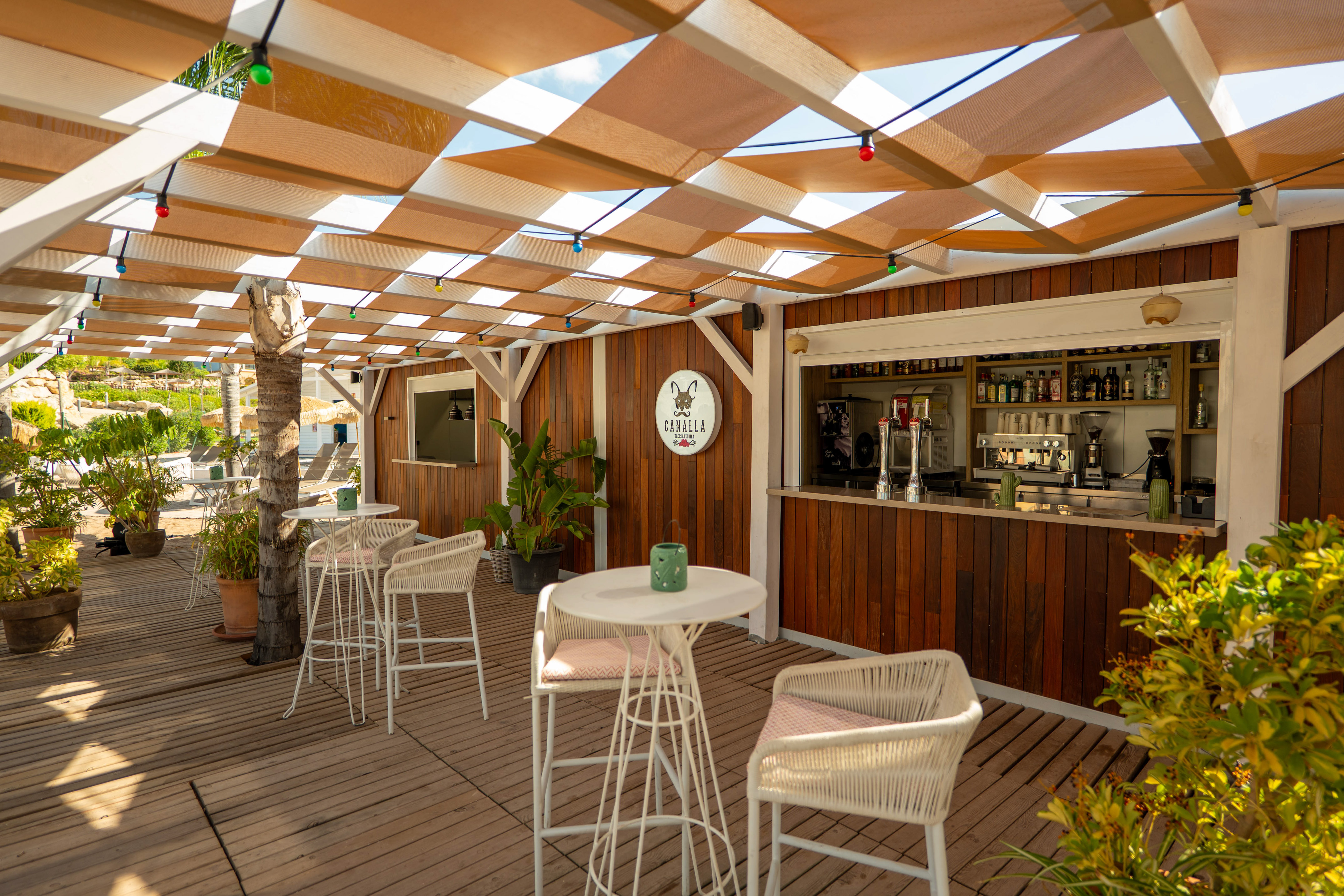 a patio with tables and chairs