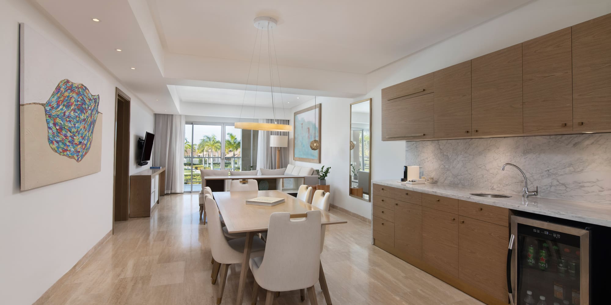 a dining table and kitchen in a room