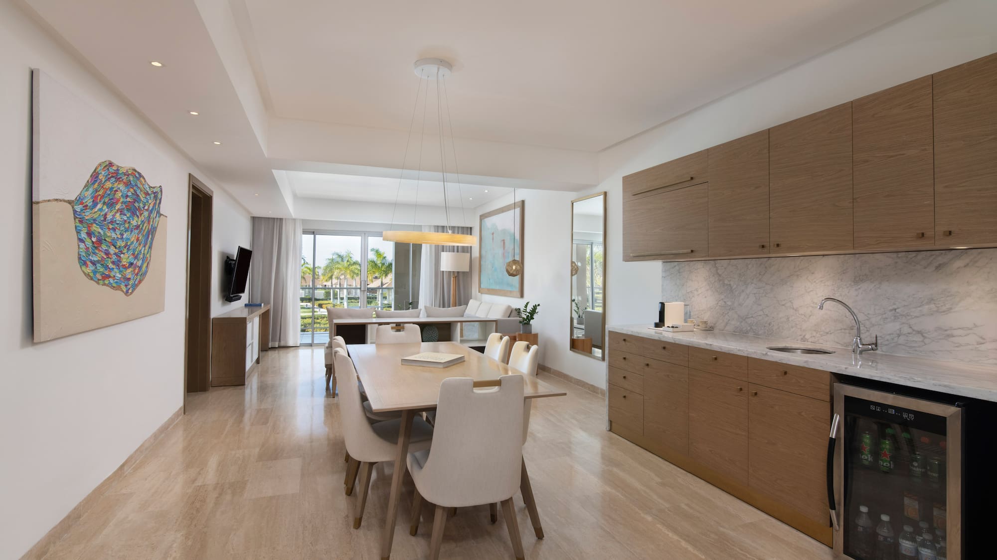 a dining table and kitchen in a room