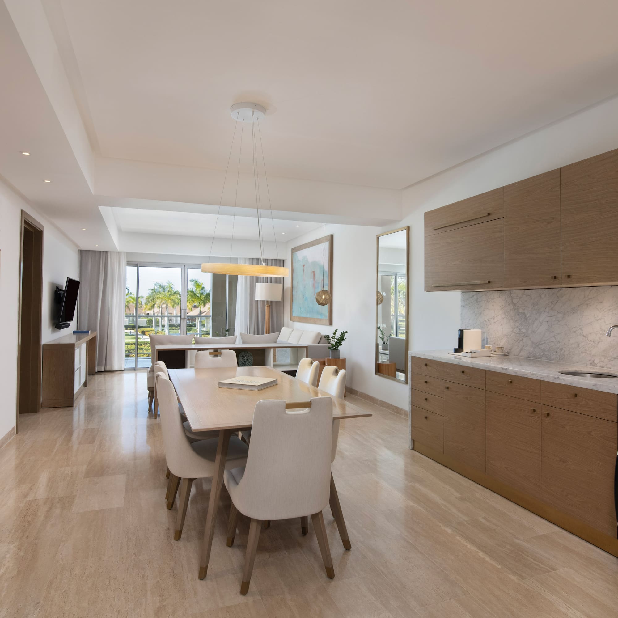 a dining table and kitchen in a room