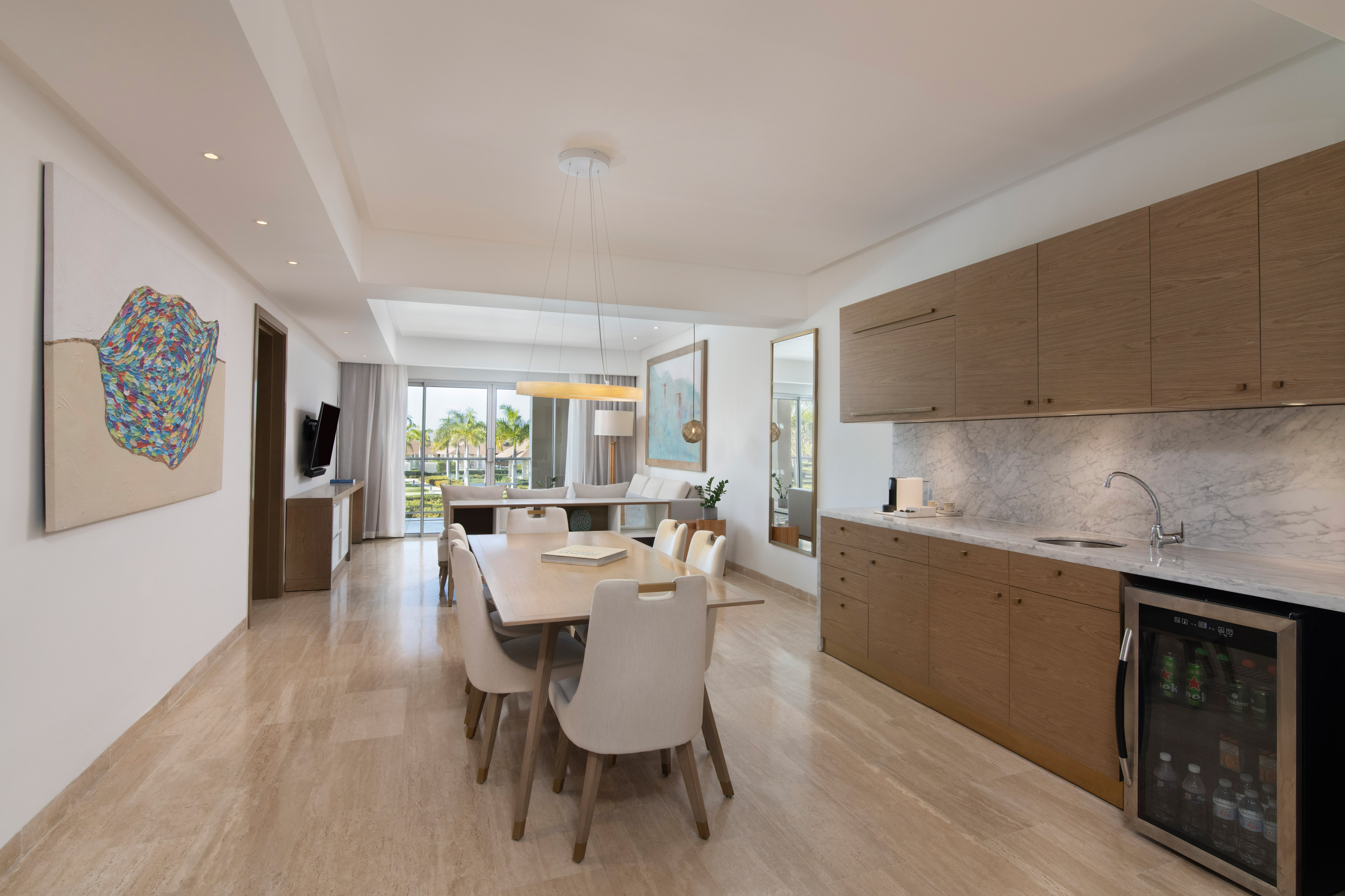 a dining table and kitchen in a room