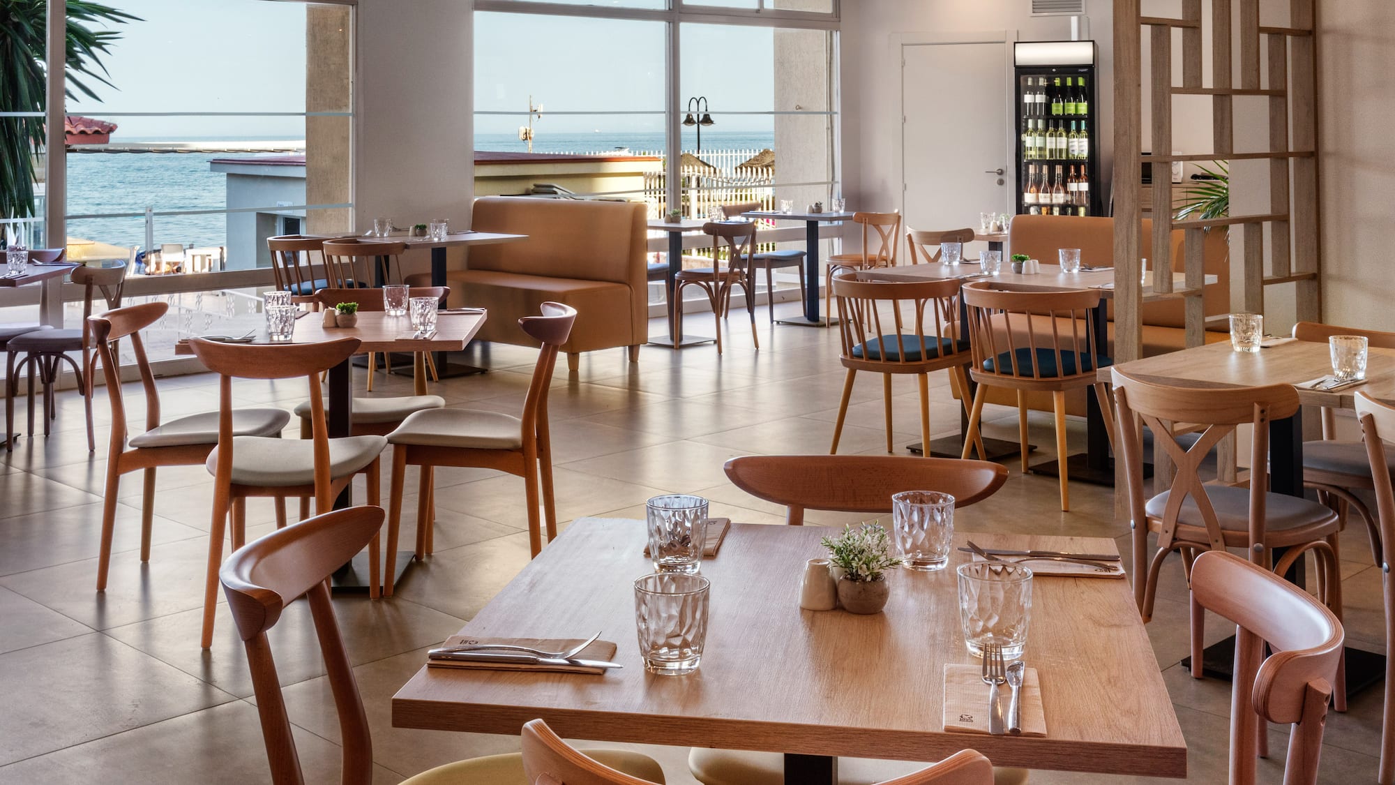 a restaurant with tables and chairs