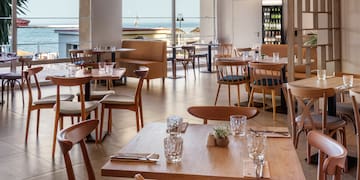 a restaurant with tables and chairs