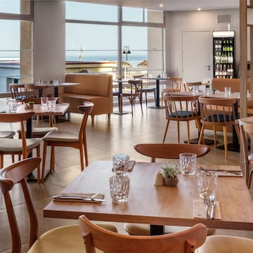 a restaurant with tables and chairs