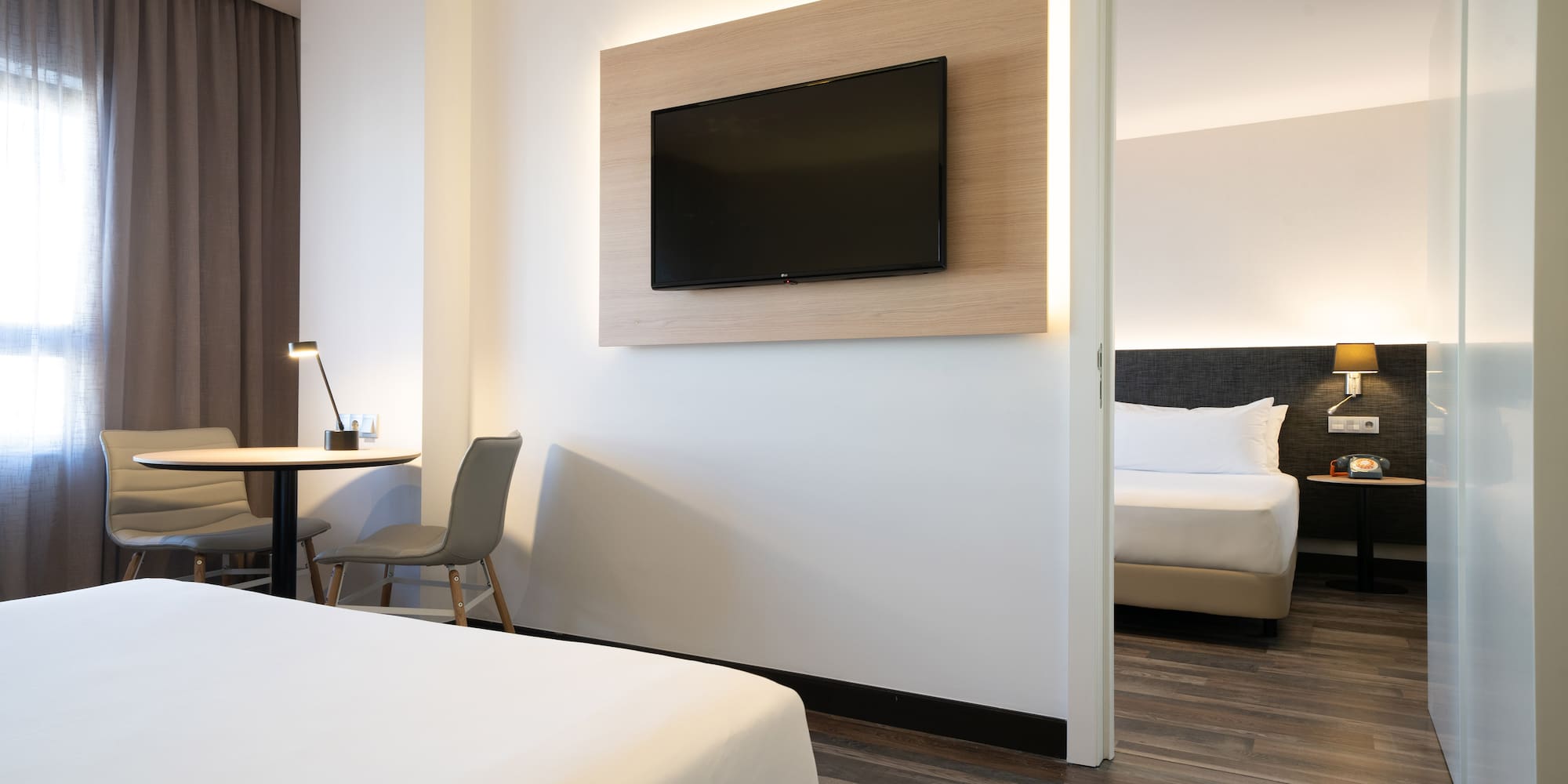 a room with a tv on the wall