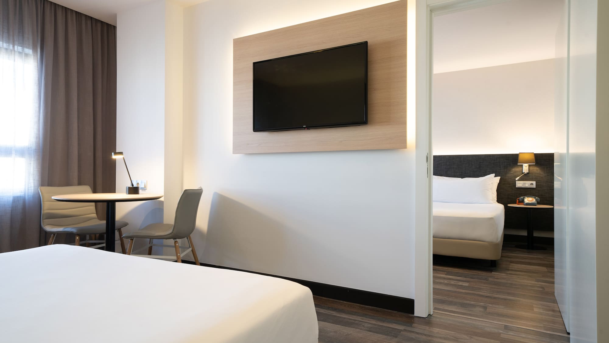 a room with a tv on the wall