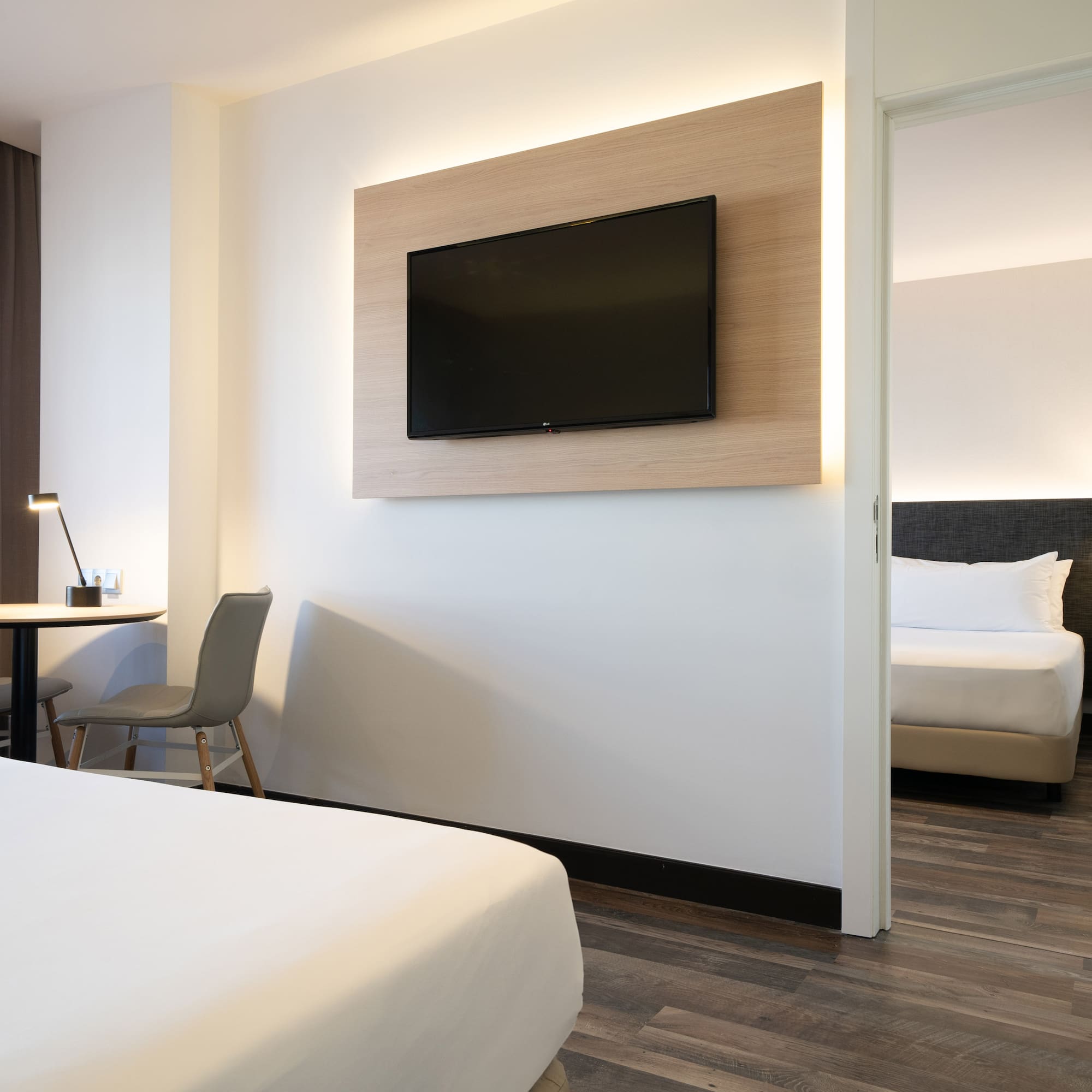 a room with a tv on the wall